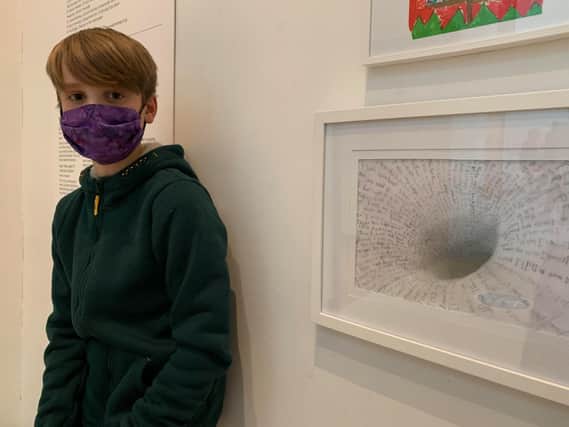 Isaac Finlay with his lockdown picture in the exhibition at the Ashmolean Museum
