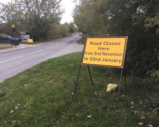 A road closure sign posted on the roadside for Warwick Road at the junction of Brookhampton Lane, which is a major through road for the village.