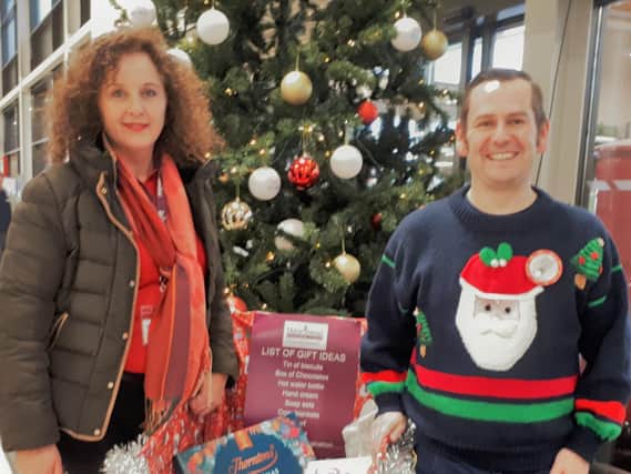 Homecare's Maria Finn and Bryan Taunton of Bicester Tesco, which was a north Oxfordshire deposit point for last year's gifts for seniors