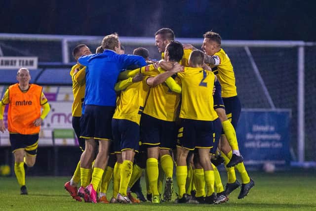 The Canvey Island players celebrate after their 2-1 success which sent them into the second round of the FA Cup