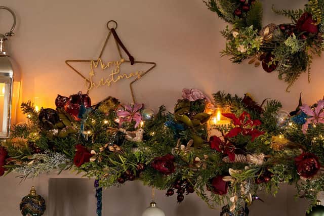 Give your mantelpiece a really Christmassy feel with decorations from Hilliers Garden Centre