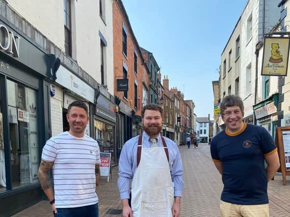 Three Banbury business owners or managers who are looking toward a positive future for the town centre. From left: Elliott Don, manager of Union Menswear, Barry Whitehouse, owner of the Banbury art supplies shop - The Artery, and Mark Allitt, owner of Revival MK2 clothing store.