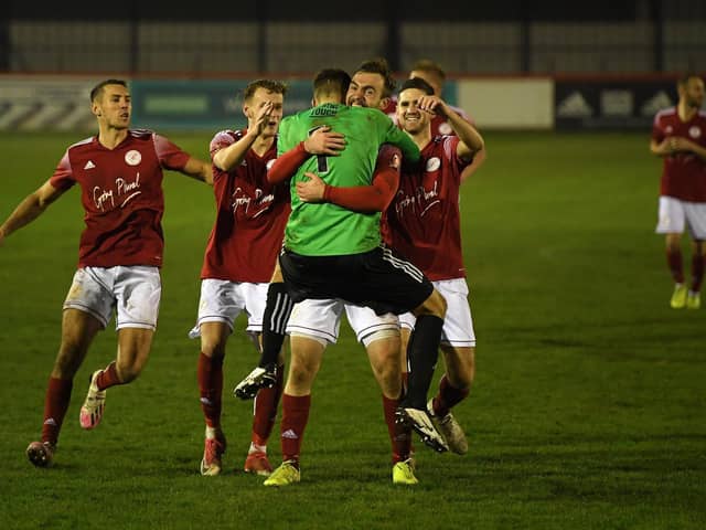 Shane Byrne was the first on hand to congratulate goalkeeper Ali Worby after Brackley Town’s FA Cup first round penalty shootout win over Bishop’s Stortford on Saturday