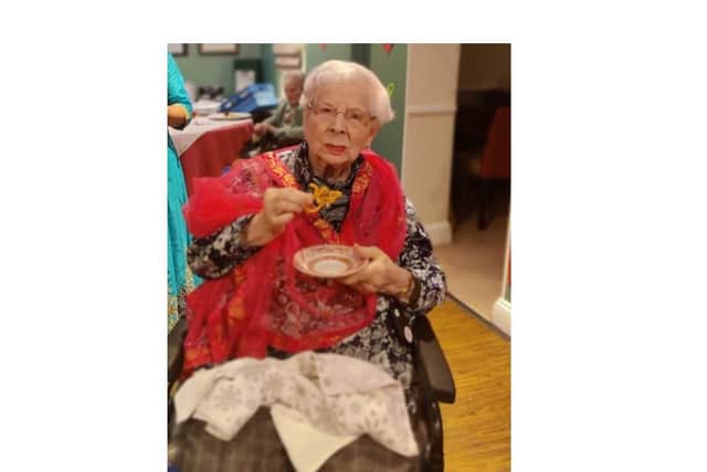 Sheila Palmer, a resident from Glebefields Care Home in Banbury, enjoys authentic food to celebrate Diwali (photo from Glebefields Care Home)