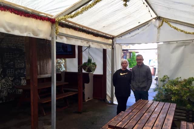 Gail and Dave Gilkes, who run the Banbury Cross pub in Butchers Row of the town centre, underneath one of the Marquees set up in the garden area of the pub