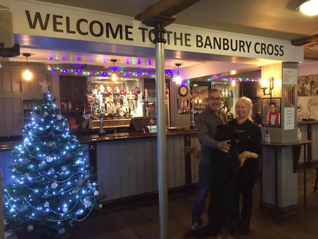 Gail and Dave Gilkes, who run the Banbury Cross pub in Butchers Row of the town centre with their dog, Bolin