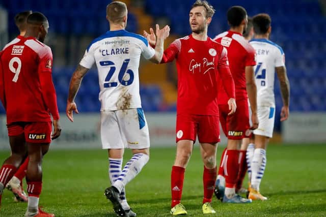 Brackley's Shane Byrne and Tranmere's Peter Clarke at full-time