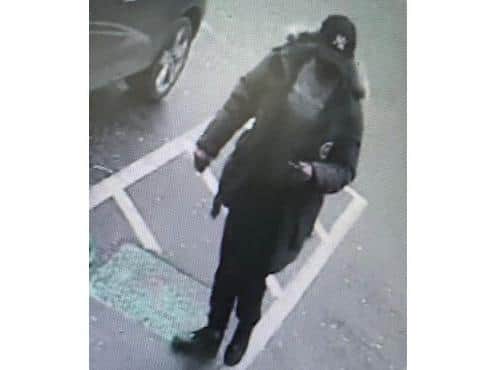 Police are looking for help in identifying a man in connection to the theft from an elderly couple outside a Banbury supermarket. (photo from Thames Valley Police)