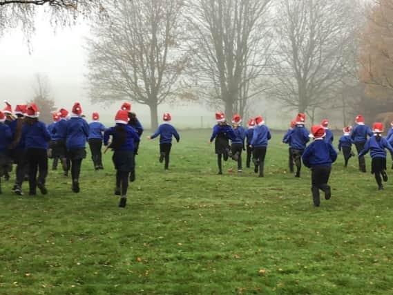 The 83 children at Wroxton Primary School have certainly risen to the challenge of a Santa Relay Run to rase funds for local charity Katherine House Hospice.