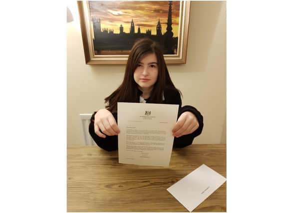 Chipping Norton, teenager Emma Church, holds the letter she received on behalf of the Prime Minister