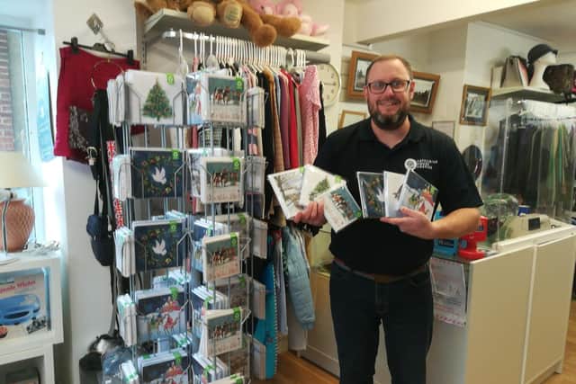 Joe Gates, selling packs of Christmas cards at one of the Katharine House Hospice shops