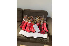 The hand sewn and filled Christmas stockings made by Aaron Speke.