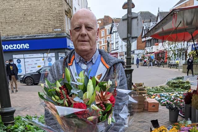 Proprietor David with a bouquet similar to one of the arrangements to be won in this week's competition