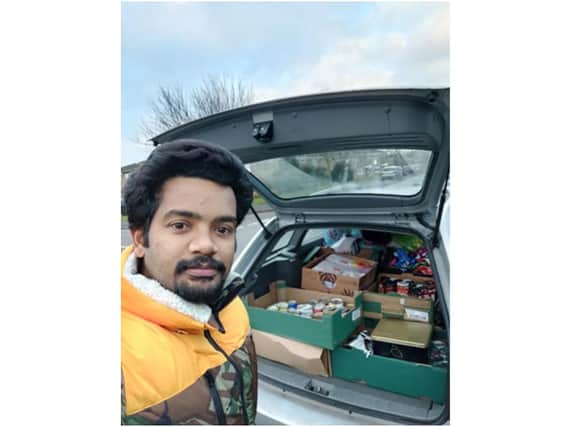 Prabhu Natarajan prepares to deliver the 606 items for 25 families from a local primary school