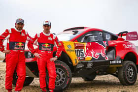 Sebastian Loeb, right, is a nine time world rally champion, driving the Dakar Rally for Prodrive