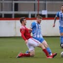 Kettering Town's Connor Kennedy and Brackley Town's Shane Byrne battle for possession during the 1-1 draw between the two clubs at St James Park. Pictures by Peter Short