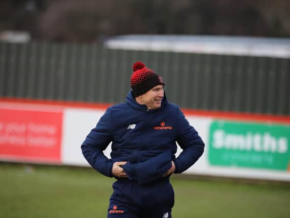 There have been reasons to smile for Brackley Town boss Kevin Wilkin after a 2-0 win over Darlington made it eight games without defeat. Picture by Peter Short