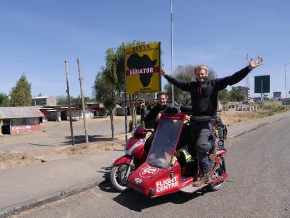 Matt Bishop, from Sibford Ferris, and Reece Gilkes, from Banbury, broke the Guinness World Record for the longest journey on scooter with a sidecar with a monumental 34,000-mile-long trip around the world. (photo taken at the Equator in Kenya)