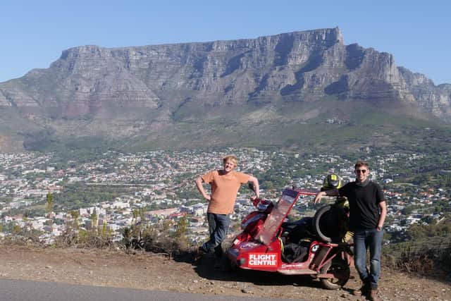 Matt Bishop, from Sibford Ferris, and Reece Gilkes, from Banbury, broke the Guinness World Record for the longest journey on scooter with a sidecar with a 34,000-mile-long trip around the world. (Photo taken in Cape Town)