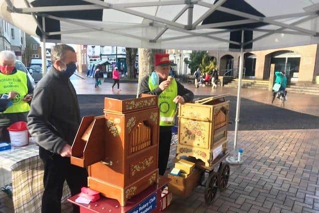 Volunteers take turns on street organs at the Banbury Rotory Club Christmas charity collection in the town centre over the holidays