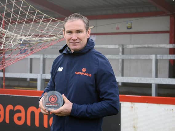 Brackley Town boss Kevin Wilkin shows off his award after he was named the Vanarama National League North manager of the month for December
