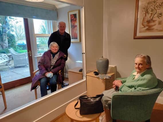 Myrtle Adkins, aged 95, and her son and daughter in law inside the 'visiting suite' at the Glebefields care home in Banbury (photo from Glebefields care home)