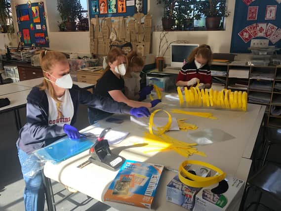 Pupils from Winchester House School make PPE for NHS staff to use across the regional (photo from Winchester House School)