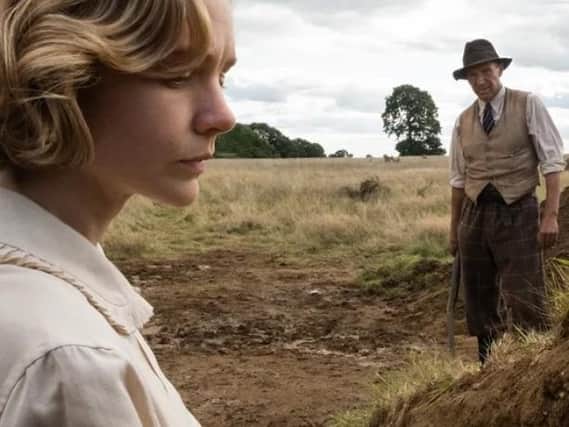 Ralph Fiennes as Basil Brown and Carey Mulligan as Edith Pretty in a scene from The Dig