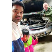 Prabhu Natarajan with his son Addhu next to Damian Leaver, who helped fix Prabhu's car with a free oil change among other items