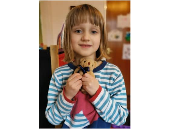 Pupil from St John's Priory School in Banbury who received a 'Care Parcel' which included a teddy bear (photo from St John's Priory School)