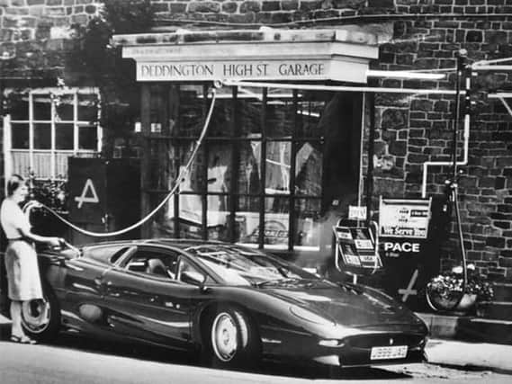 Back in the day - a Jaguar XJ220 filling up with petrol in Deddington High Street