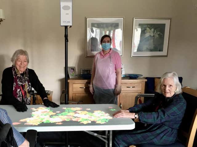 Juniper House Activity Co-ordinator Mikala Bowman pictured with Juniper House Residents. (photo from Juniper House Care Home)