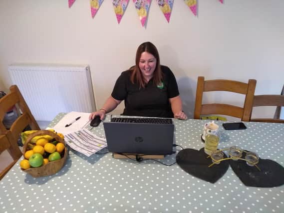 Hannah Beal, Family Dog Service Instructor at Dogs for Good pictured here doing a virtual session (photo from Dogs for Good charity)