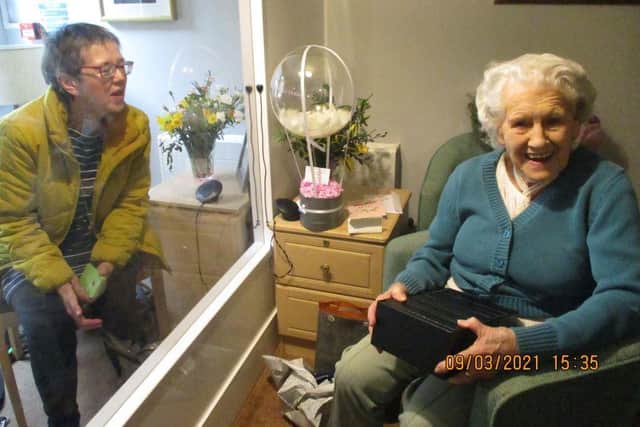 Mary Collier visits a relative to mark her 100th birthday on March 9 (photo from Glebefields care home)