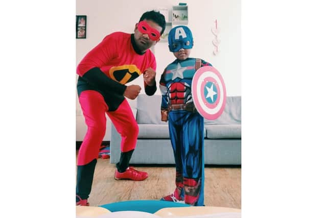 Prabhu Natarajan and his son Addhu dressed as superheroes as they delivered food packs to the community as way of marking his son's sixth birthday earlier this year