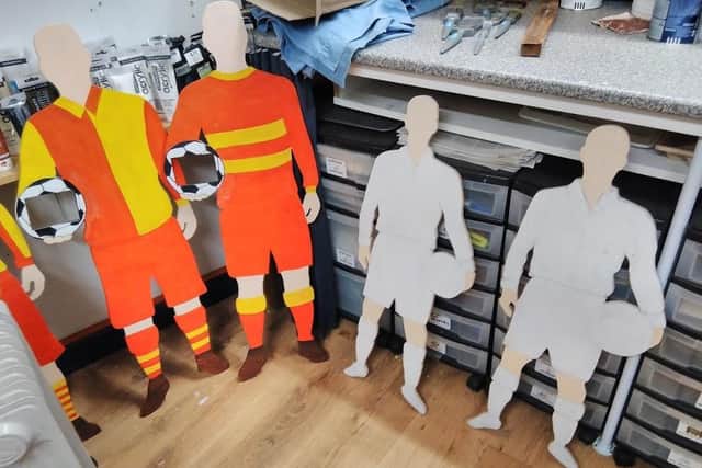 Series of 2-D cutouts of footballers wearing historic kits help Banbury United Football Club mark its 90th anniversary this year - made by Roger Davis,
one of club’s ground staff volunteers