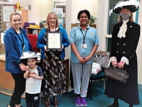 Banbury's Sunshine Centre staff and children welcomed Amanda Ponsonby, right, for the presentation of the 'local treasure' award