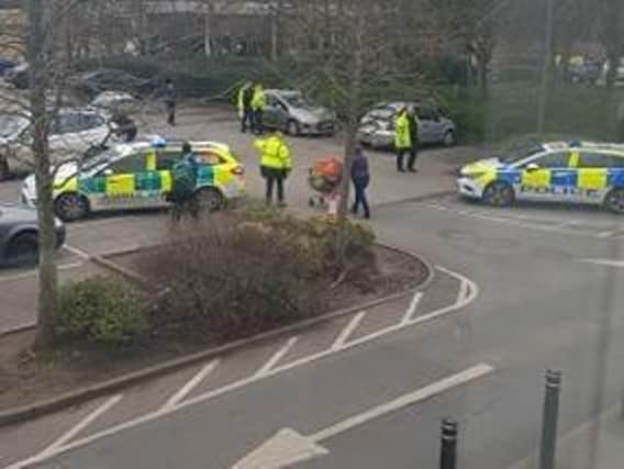The scene at Sainsbury yesterday (Saturday) in which a woman was hit by a car being driven dangerously