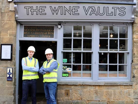 Officials with Gamechanger Pubs stand outside The Wine Vault pub in town centre Banbury