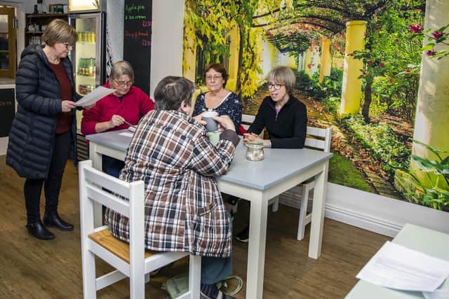Customers enjoy morning coffee and cake at the Horton View Community Cafe