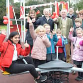 Banbury Town Mayor Cllr John Colegrave joins teachers Sarah Moon and Caroline Debus, Steve Sylvester (managing director of equipment manufacturers Kompan), Thomas Griffiths (area sales manager Kompan), and the pupils at the play area opening.