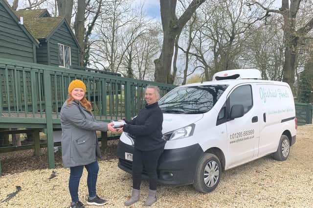 Susie Medcalf hands over a delivery from Ofishial Foods to Kate Ashfield of Winchcombe Farm. Photo supplied.