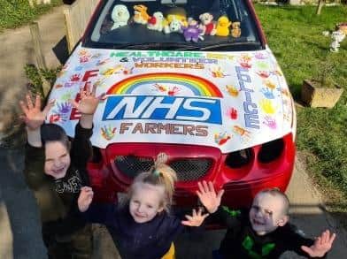 The car painted by Banbury man, Wayne Cowley, to thanks the NHS and other key workers during the coronavirus. Pictured: Wayne and Laura Cowley's children: Ti, Theo and Chiana