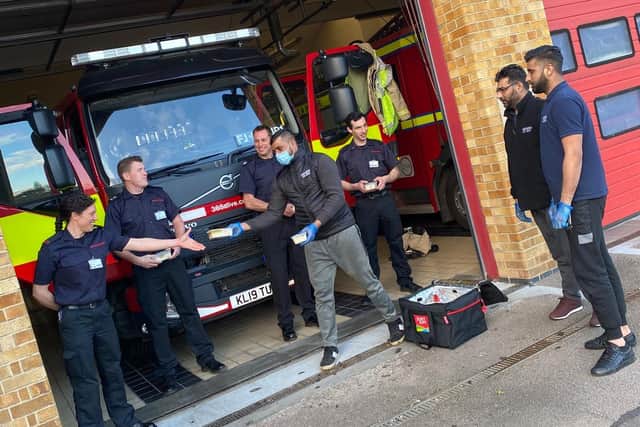 Volunteers with Banbury Spicy Kebabishdeliver food to Banbury Fire Station