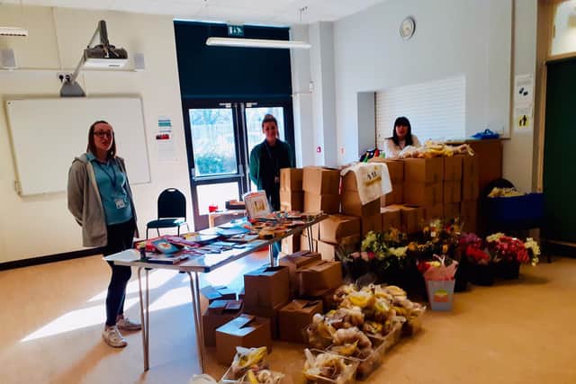Volunteers at the Sunshine Centre sort out items being given away in the community