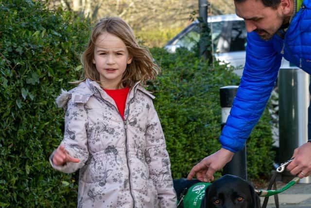Emily Chilvers with assistance dog Oslo and dad Steven