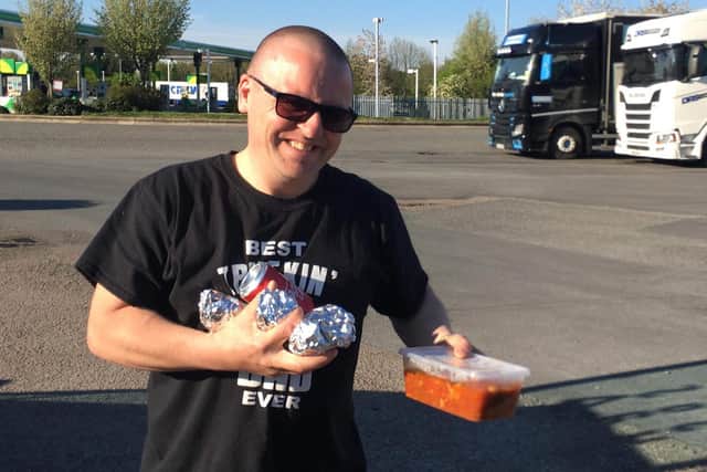 Truck driver Patrick Owens delivers hot meals to other truck drivers across the region