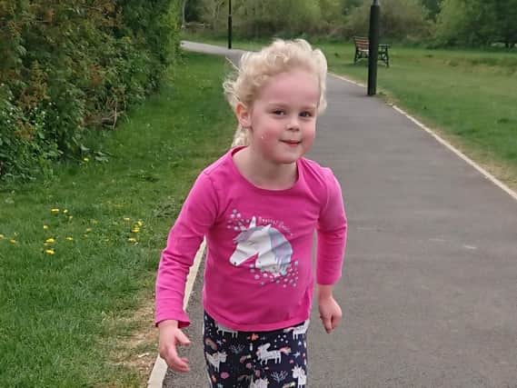 Five-year-old Anna Williams strides out on her 5km run
