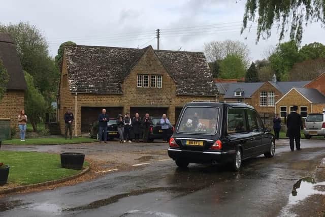 Hornton villagers line the route in a resurrection of a tradition of bidding farewell to neighbours. Picture by Roger Corke