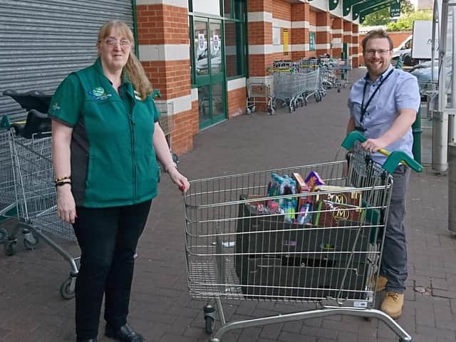 Dr Robbie Kerry, consultant anaesthetist at the Horton intensive care unit, takes delivery of the first batch of ices and water from Morrisons community champion, Mandy Merry